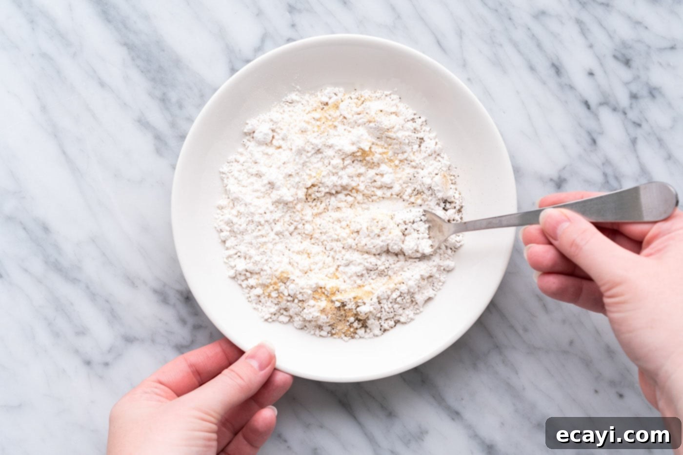 Crispy Air Fryer Chicken Cordon Bleu 9 Bowl with flour and seasonings mixed for dredging