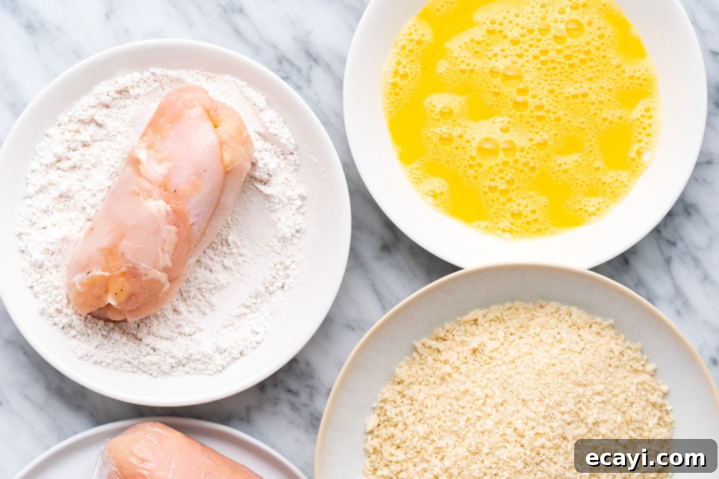 Crispy Air Fryer Chicken Cordon Bleu 10 Dredging chicken cordon bleu in flour mixture