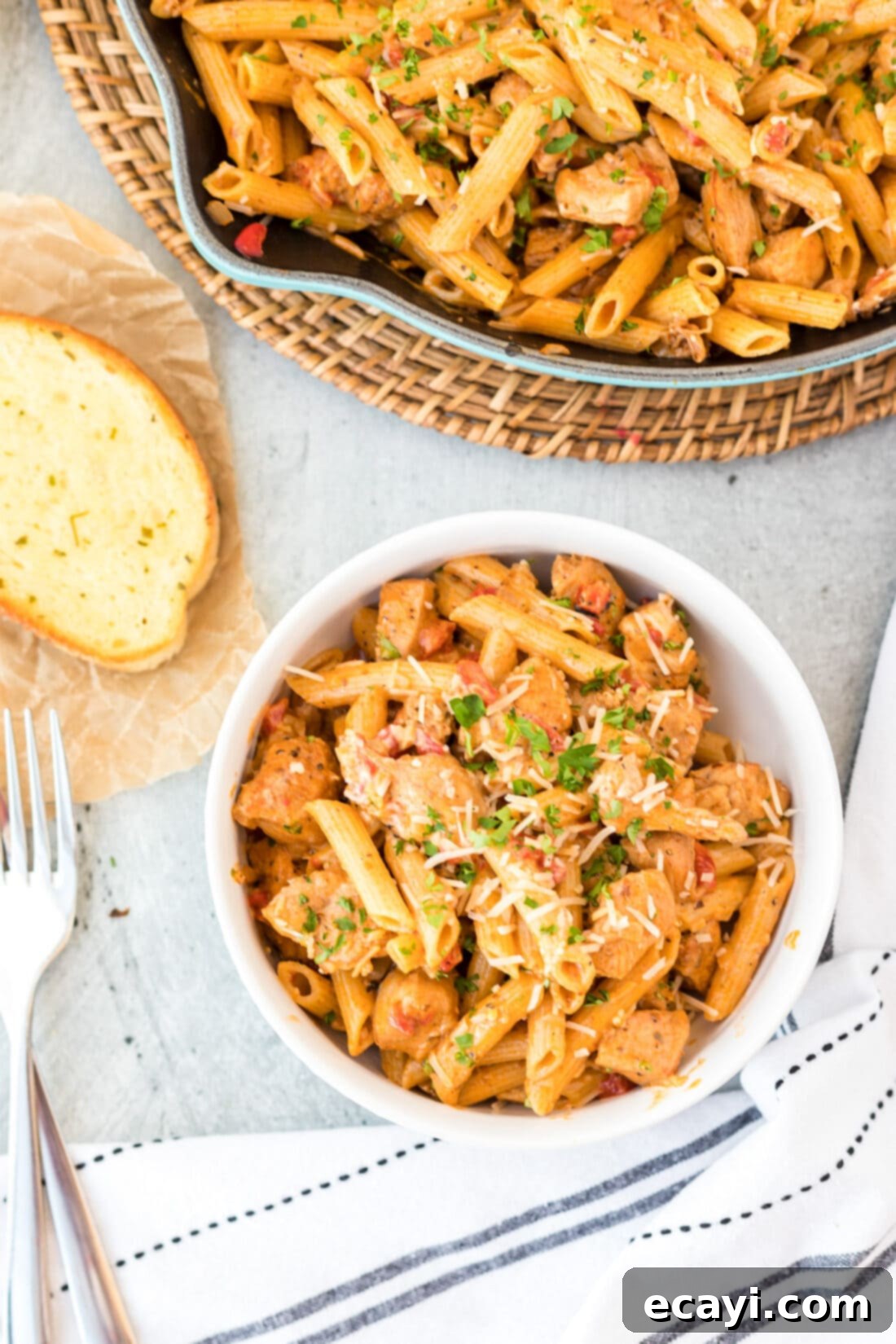 Spicy Cajun Chicken Pasta 3 Close-up of a bowl of Creamy Cajun Chicken Pasta, garnished with fresh herbs.