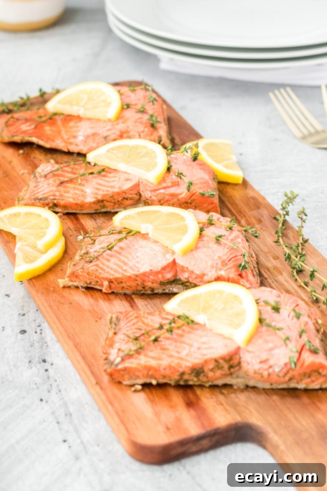 Perfectly Poached Salmon 5 4 filets of Poached Salmon on wooden board