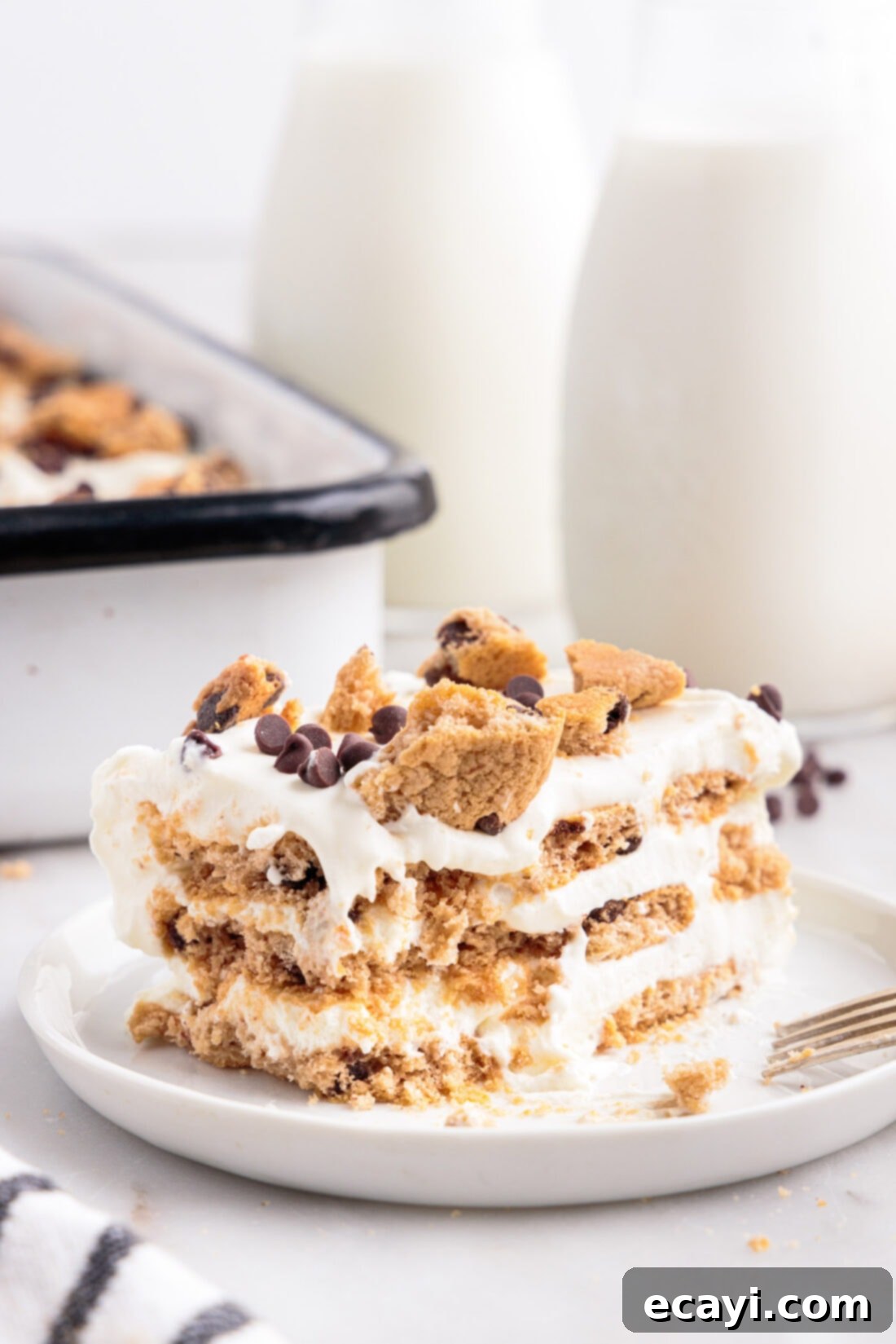 No-Bake Chocolate Chip Cookie Dream Cake 10 A slice of Chocolate Chip Cookie Icebox Cake with a bite taken out, showing the soft, layered texture.