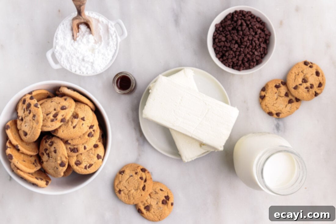 No-Bake Chocolate Chip Cookie Dream Cake 4 All the ingredients laid out on a table, including cream cheese, heavy cream, powdered sugar, vanilla extract, and Chips Ahoy cookies, for making Chocolate Chip Cookie Icebox Cake.
