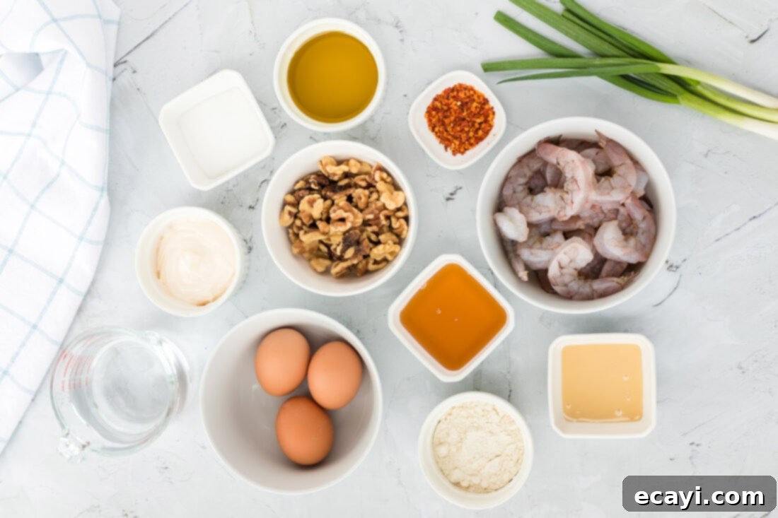 Candied Honey Walnut Shrimp 4 Various ingredients laid out for Honey Walnut Shrimp preparation, including shrimp, walnuts, honey, mayonnaise, and other sauce components
