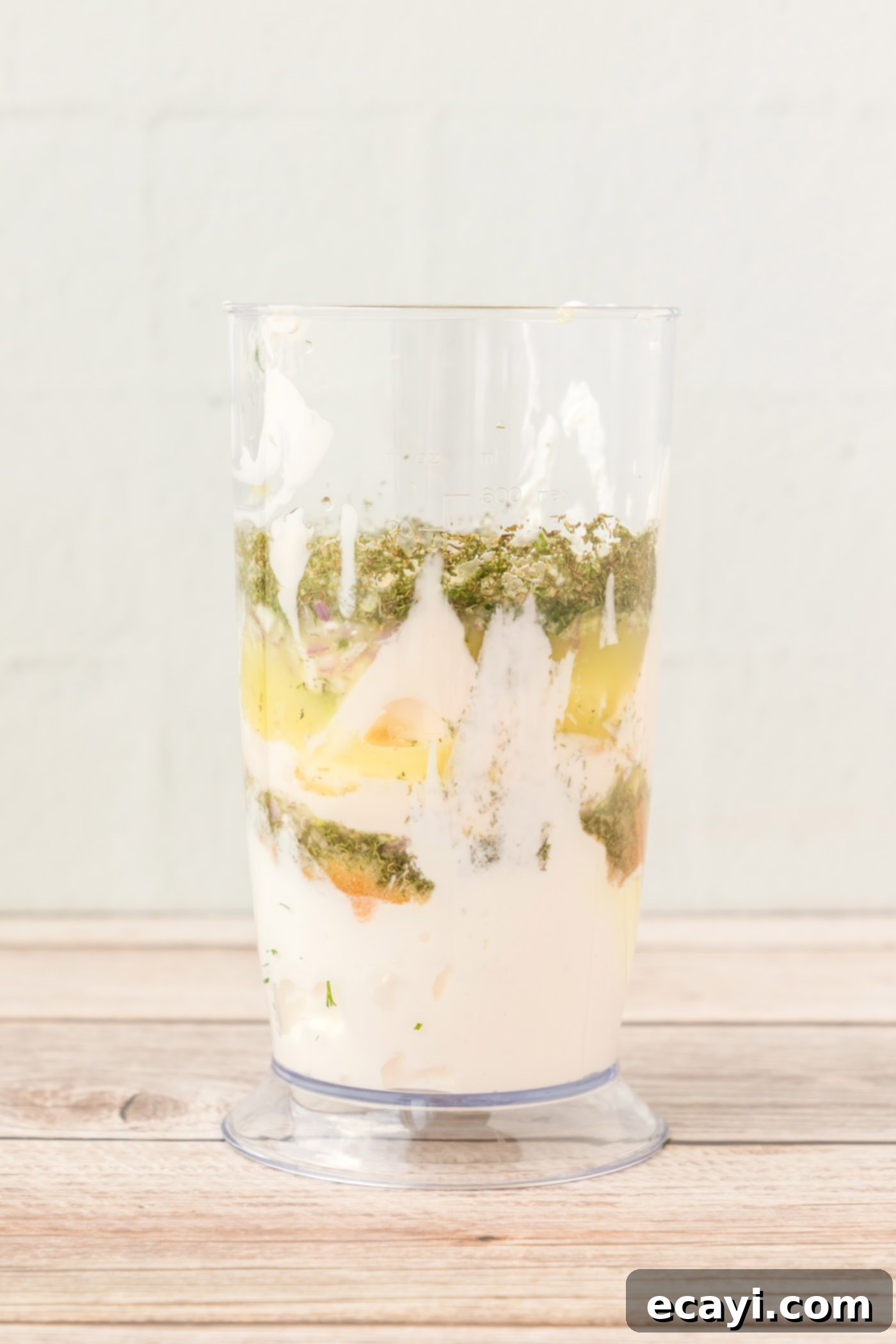 Creamy Dill Dream 5 All dill dip ingredients placed into an immersion blender cup, ready for mixing.