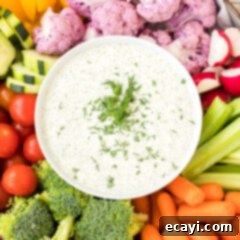 Creamy Dill Dream 8 A top-down shot of the finished creamy dill dip in a bowl, garnished with fresh dill.