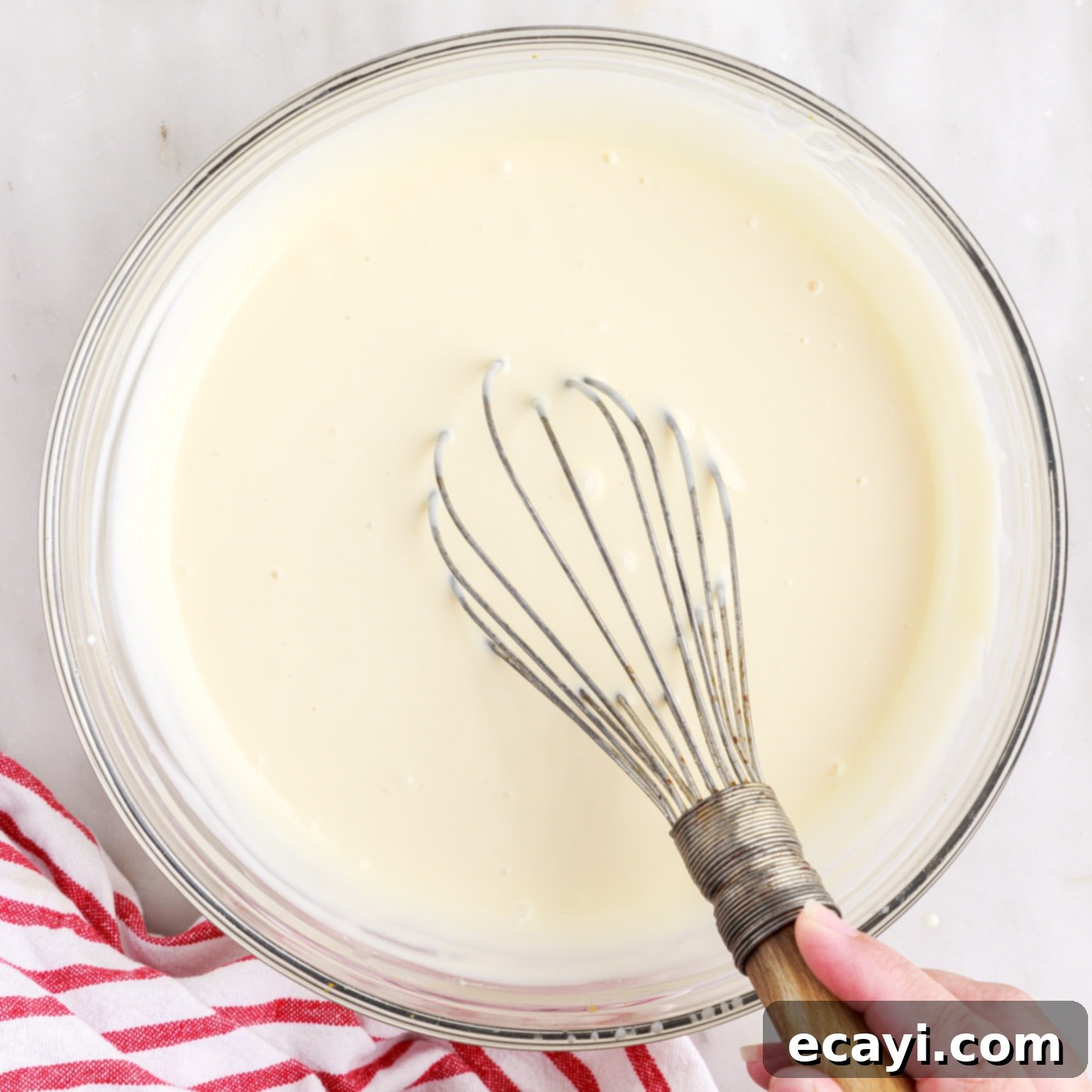 Ice Cream Rolls 5 ingredients for rolled ice cream whisked in a bowl