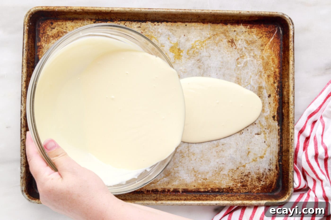 Ice Cream Rolls 6 pouring rolled ice cream ingredients into a pan