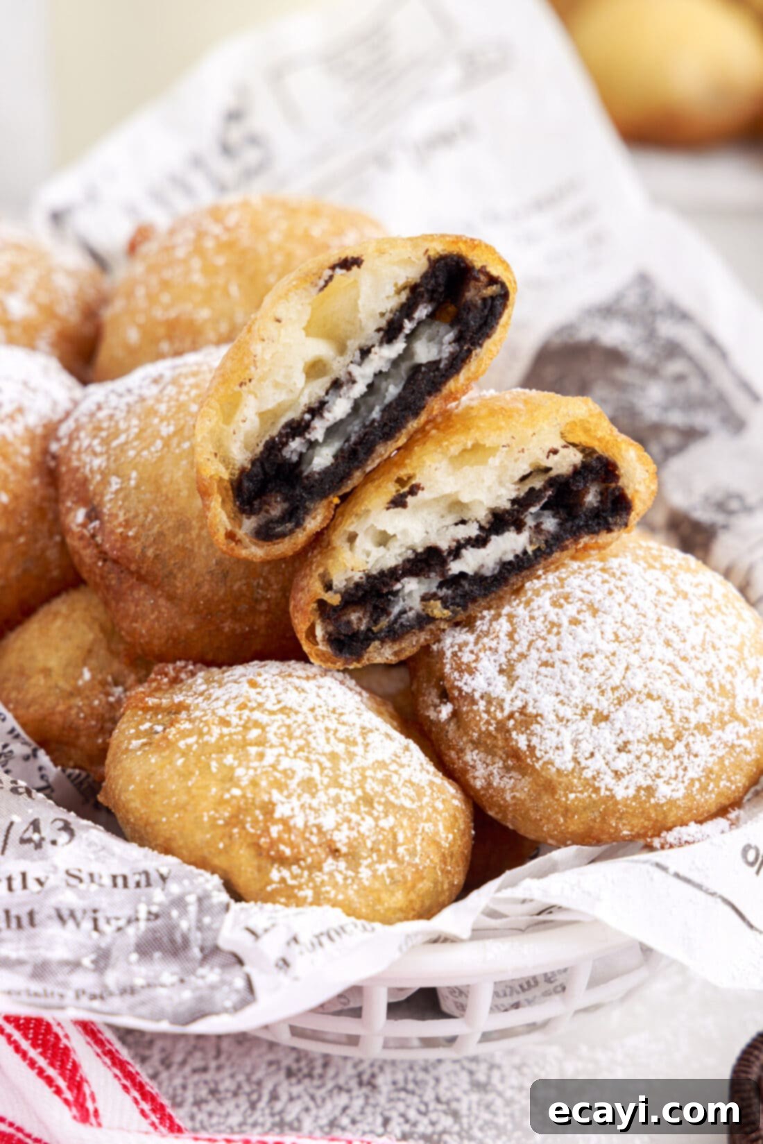 Deep-Fried Oreo Delight 2 A basket full of golden-brown homemade Fried Oreos, dusted with powdered sugar, ready to be enjoyed.