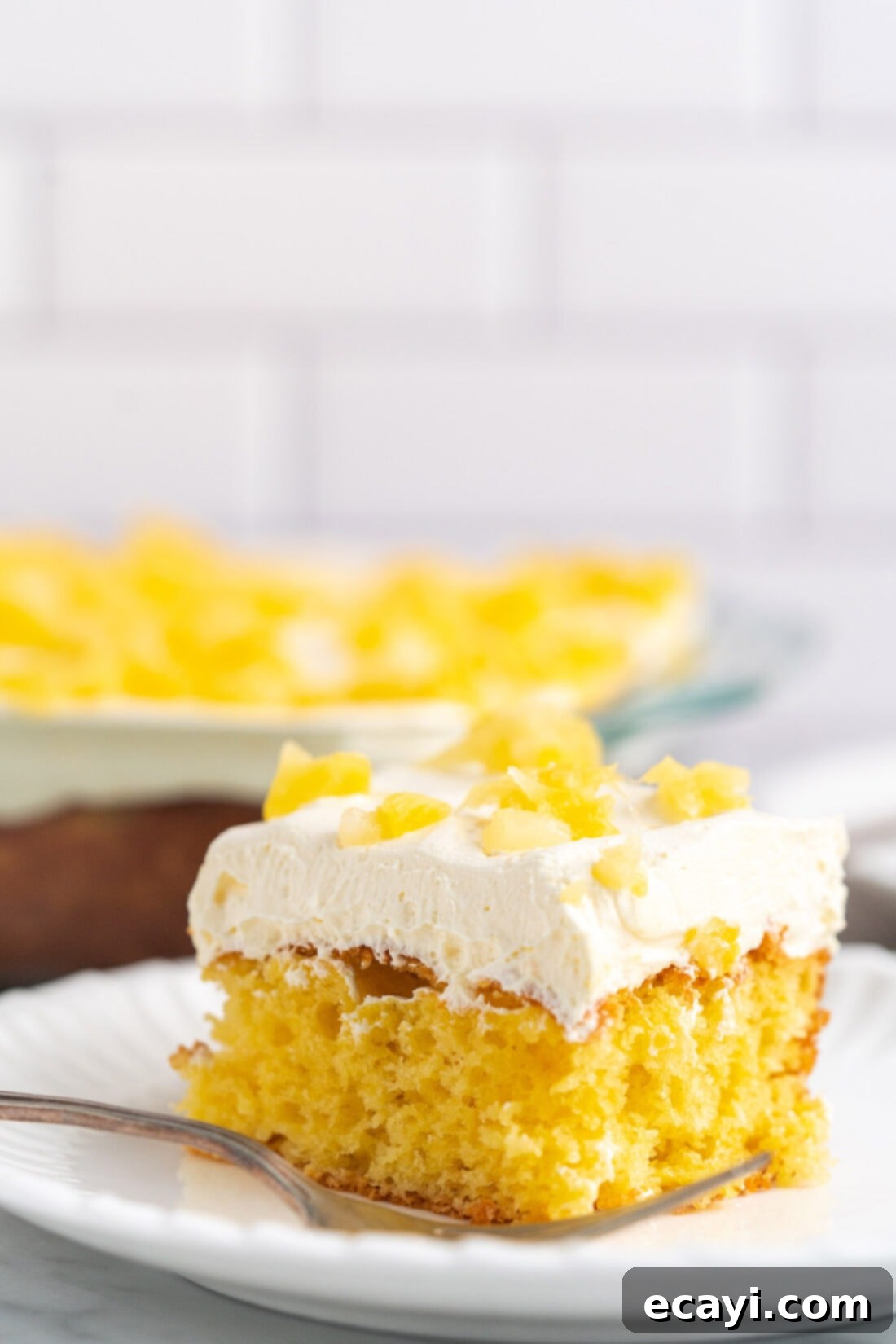 Radiant Pineapple Delight 14 Beautifully frosted Pineapple Sunshine Cake on a serving platter