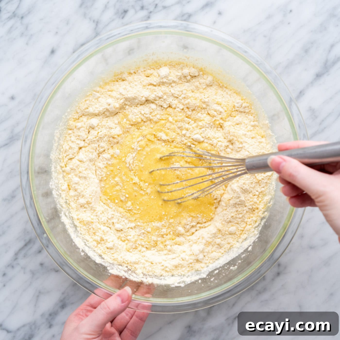 Radiant Pineapple Delight 6 Whisking together cake mix, crushed pineapple, eggs, and oil in a large bowl