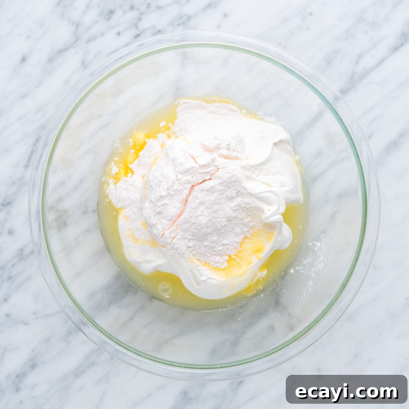 Radiant Pineapple Delight 10 Combining pineapple juice, whipped cream, and instant vanilla pudding mix in a bowl