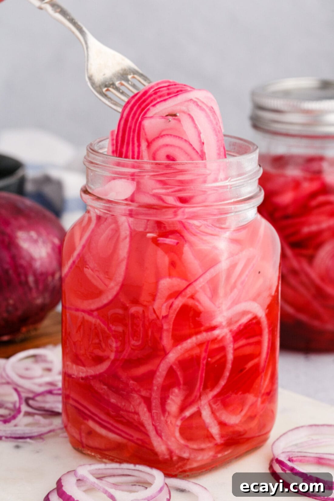 Tangy Pickled Onions 2 lifting Pickled Onions with a fork