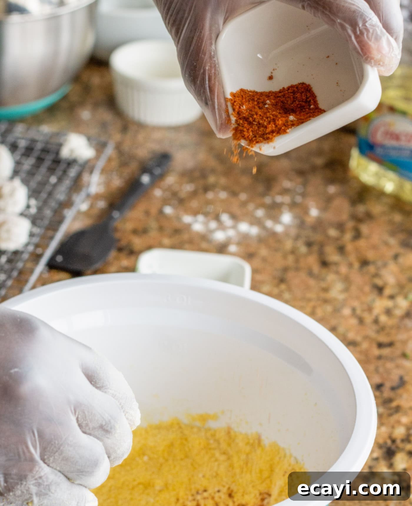 Crispy Golden Shrimp Po' Boy 7 Adding Old Bay seasoning and salt to the egg and milk mixture, enhancing flavor before shrimp are dipped.