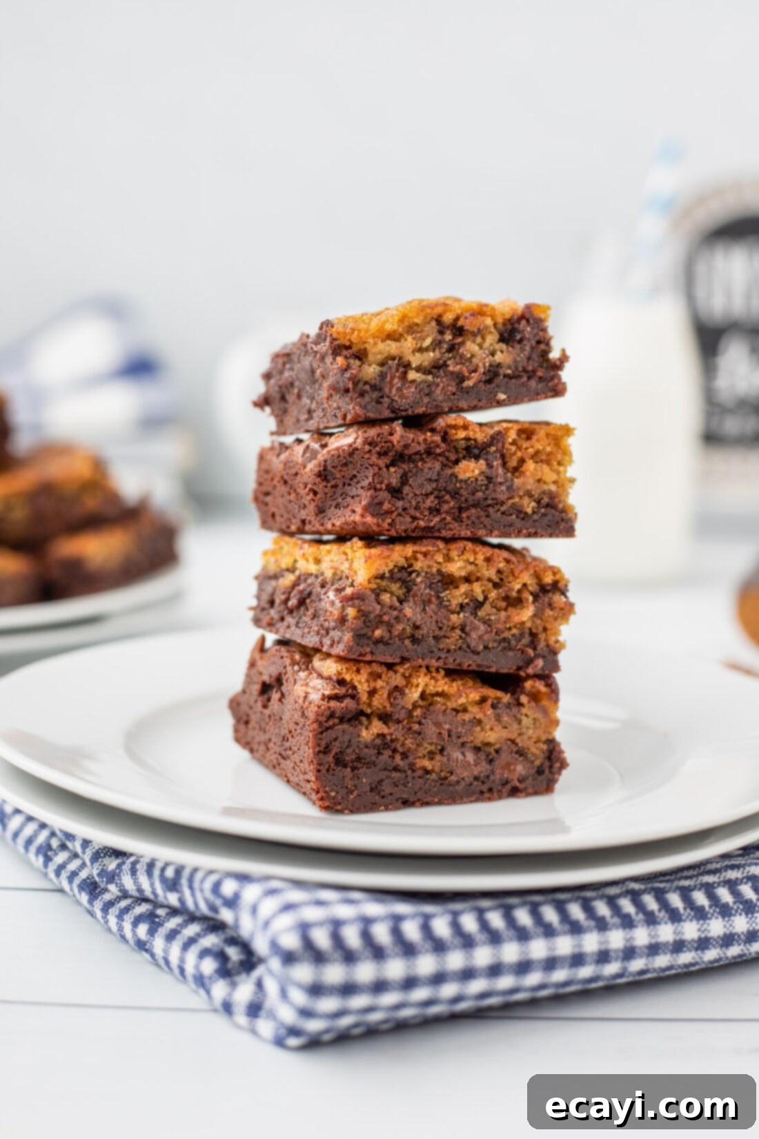 Cookie Brownie Perfection 2 stack of Brookies on a plate, showcasing the distinct brownie and cookie layers