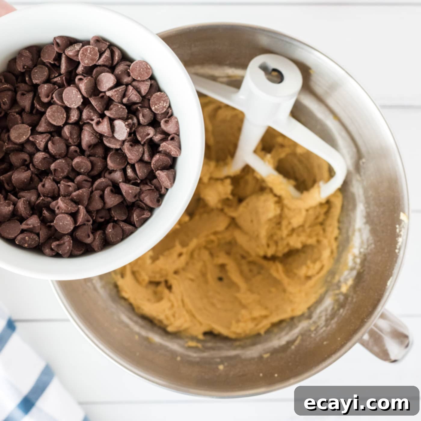 Cookie Brownie Perfection 14 chocolate chips folded into the cookie dough in a bowl