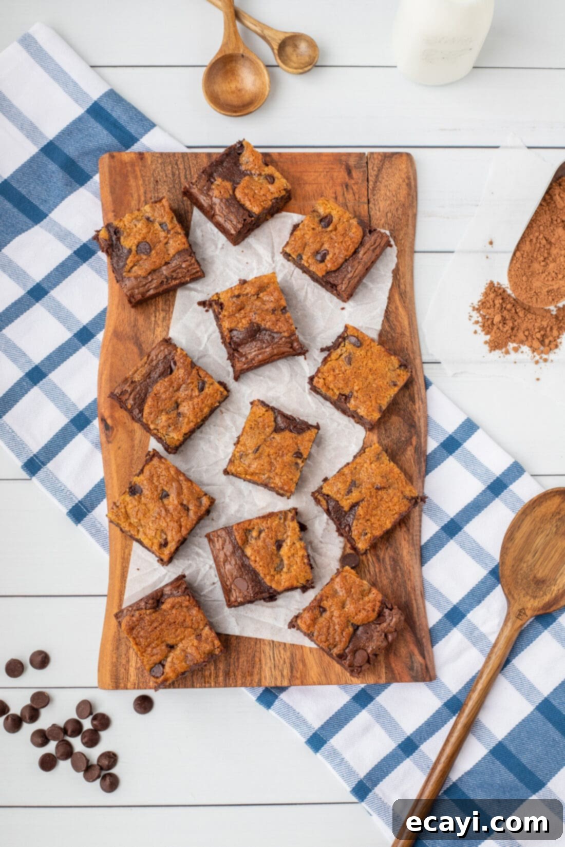 Cookie Brownie Perfection 16 freshly baked Brookies bars on a cutting board, ready to be sliced