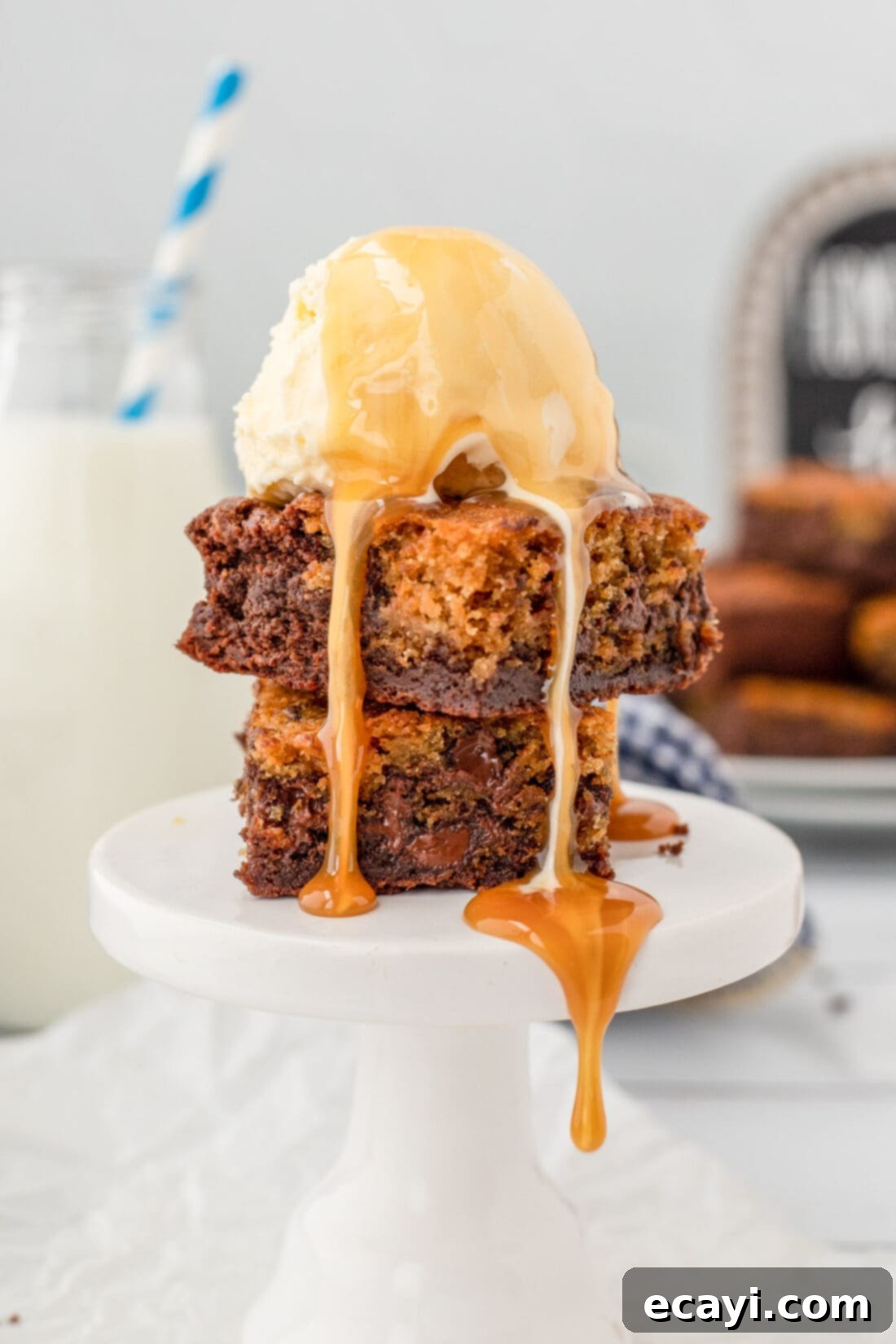 Cookie Brownie Perfection 3 Brookies served with a scoop of vanilla ice cream, ready to be enjoyed