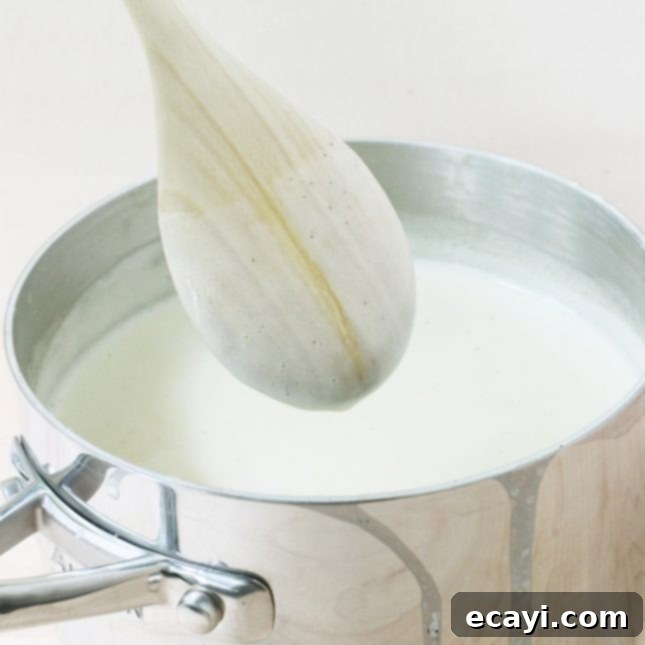 Homemade Italian Gelato: Simple Steps to Sweet Perfection 10 Custard coating the back of a wooden spoon // Classic Vanilla Bean Gelato // FoodNouveau.com