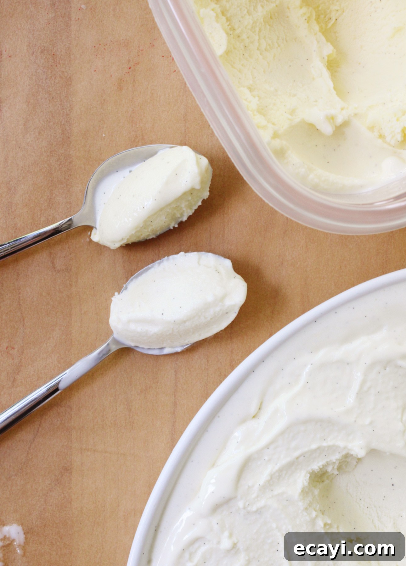 Homemade Italian Gelato: Simple Steps to Sweet Perfection 5 A top view of classic gelato compared to Sicilian-style gelato. Classic gelato is shown at the top in an open container and in a spoon, which show a pale yellow color. Sicilian-style is shown in an open container and in a spoon at the bottom and it has a bright white, creamy appearance. // FoodNouveau.com