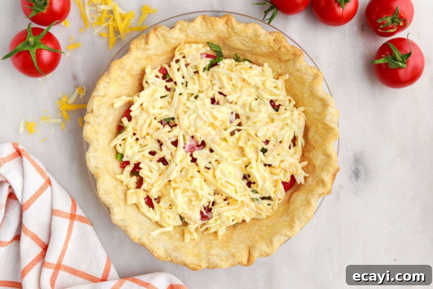 Summer Tomato Tart 11 cheese on top of tomato and basil in pie