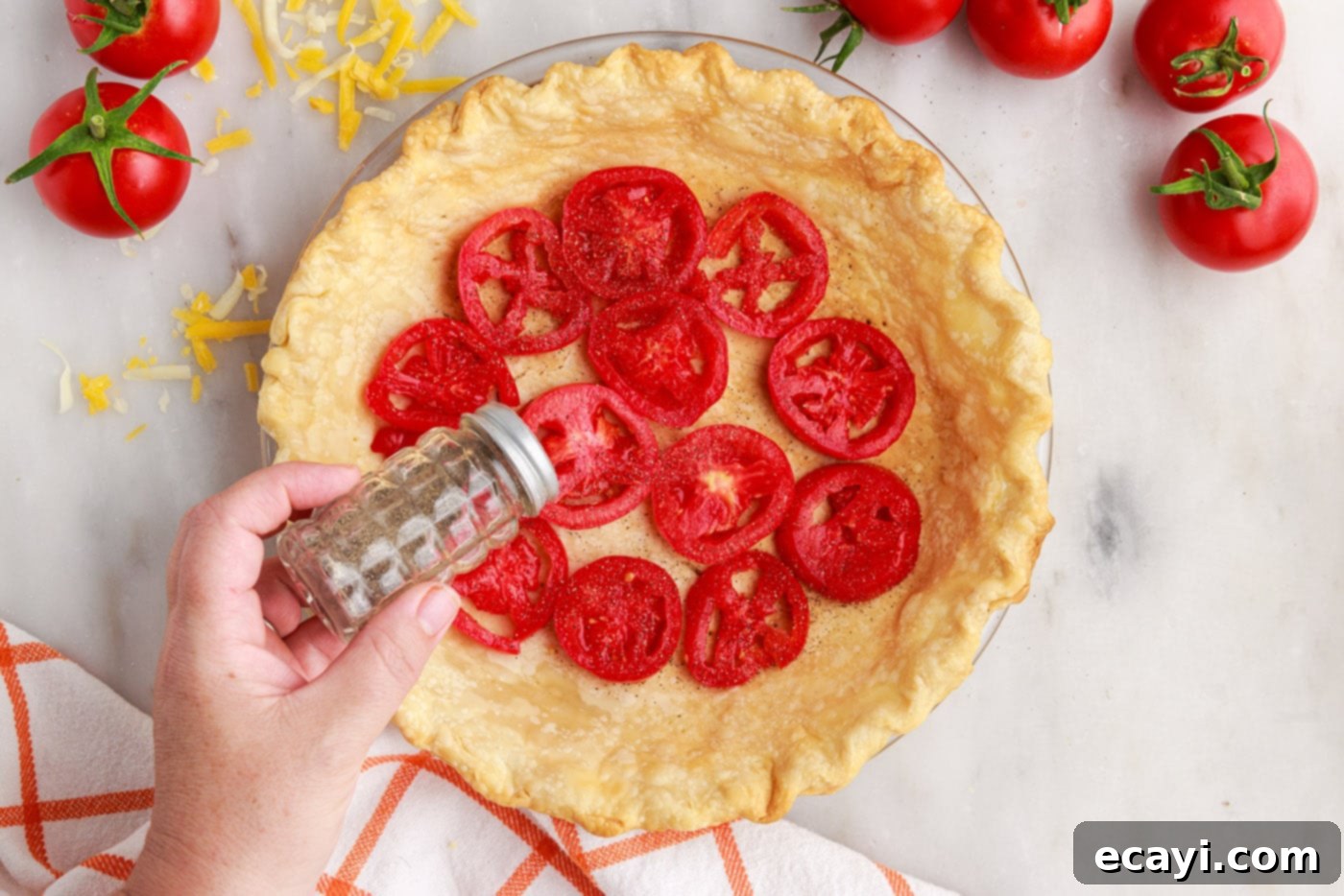 Summer Tomato Tart 7 sprinkling black pepper on top of tomato pie