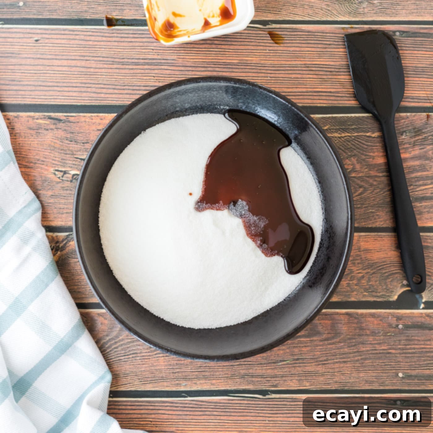 Sweet Swaps for Brown Sugar 5 molasses drizzled over granulated sugar in a bowl