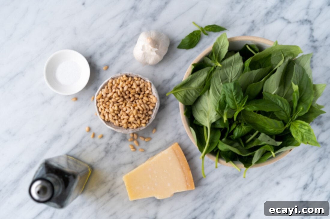 Pesto Perfection 4 A flat lay photograph showcasing all the fresh ingredients needed to make pesto, including basil leaves, pine nuts, garlic, Parmesan cheese, and a bottle of olive oil.