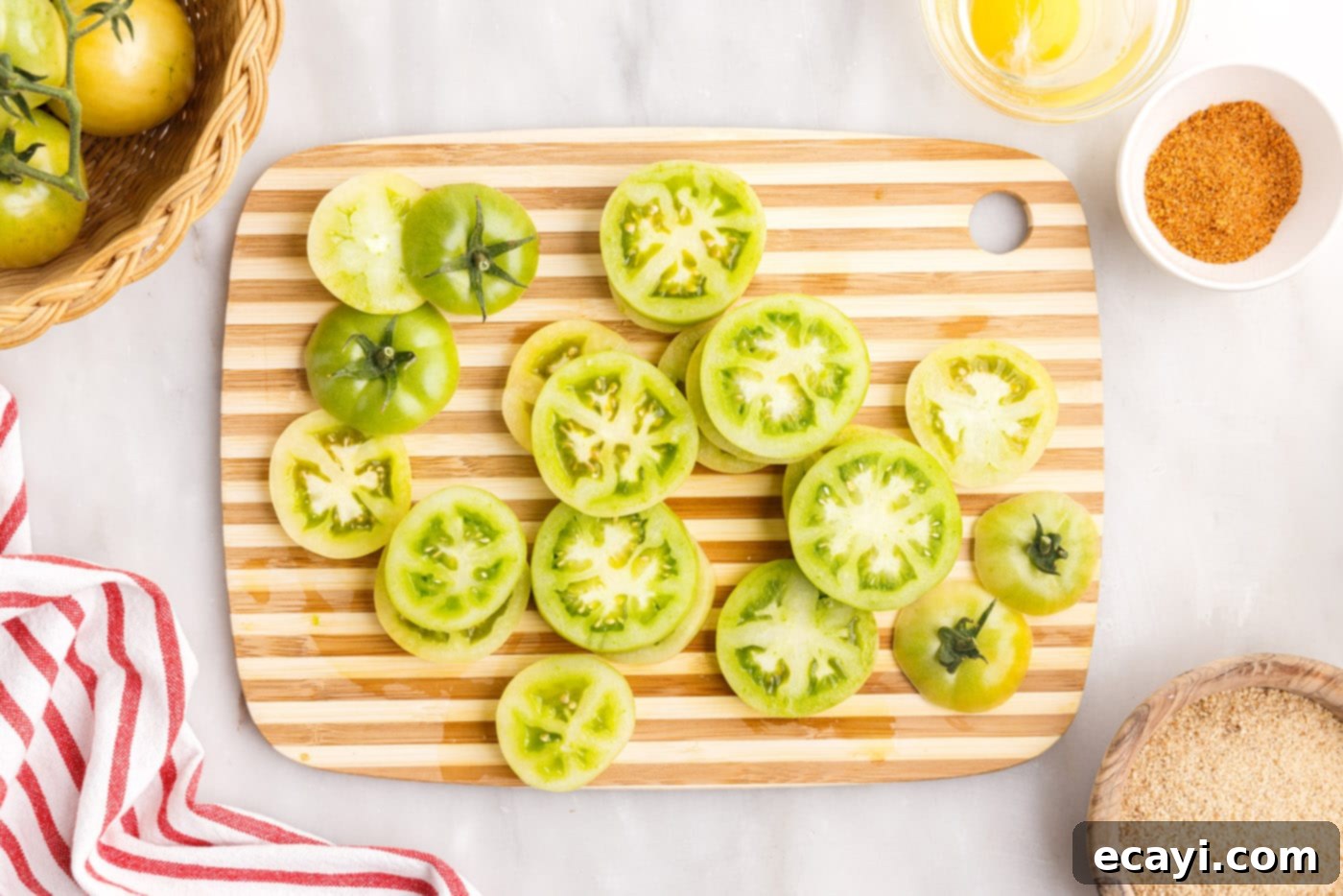 Deep Fried Truths 5 sliced green tomatoes on a cutting board