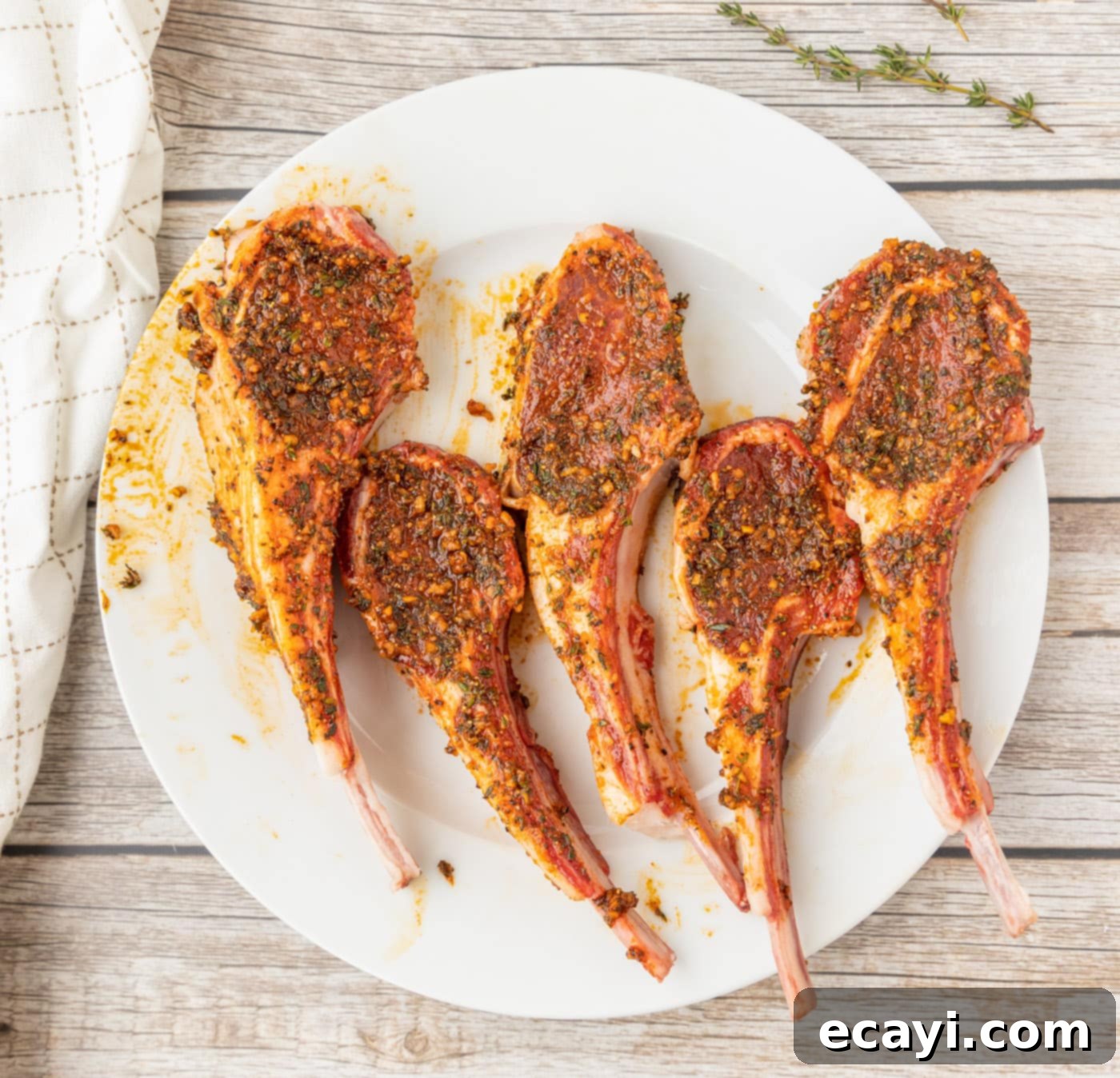 Char-Grilled Lamb Delights 7 Lamb loin chops fully rubbed with spices, ready for grilling.