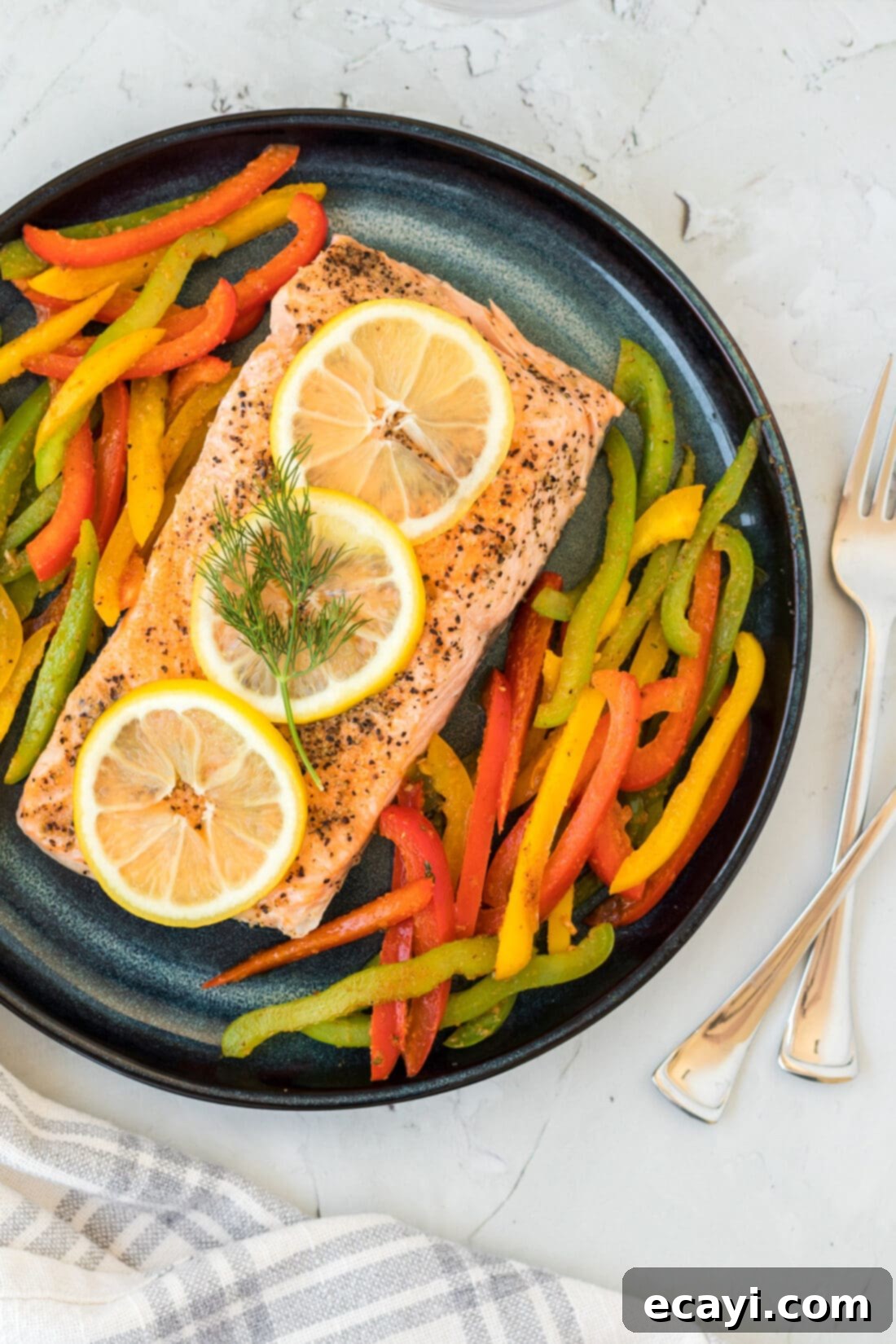 Effortless Instant Pot Salmon 2 Instant Pot Salmon with peppers and lemon slices on a plate