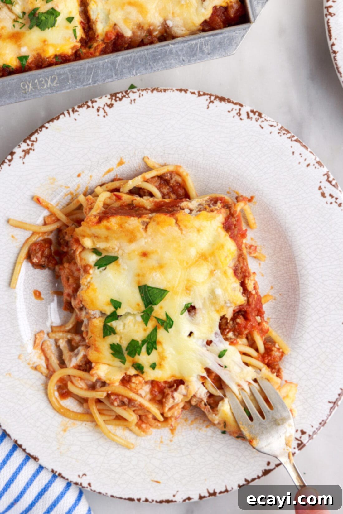 The Ultimate Million Dollar Spaghetti 16 A freshly plated serving of Million Dollar Spaghetti Casserole, showcasing its delicious texture and layers.