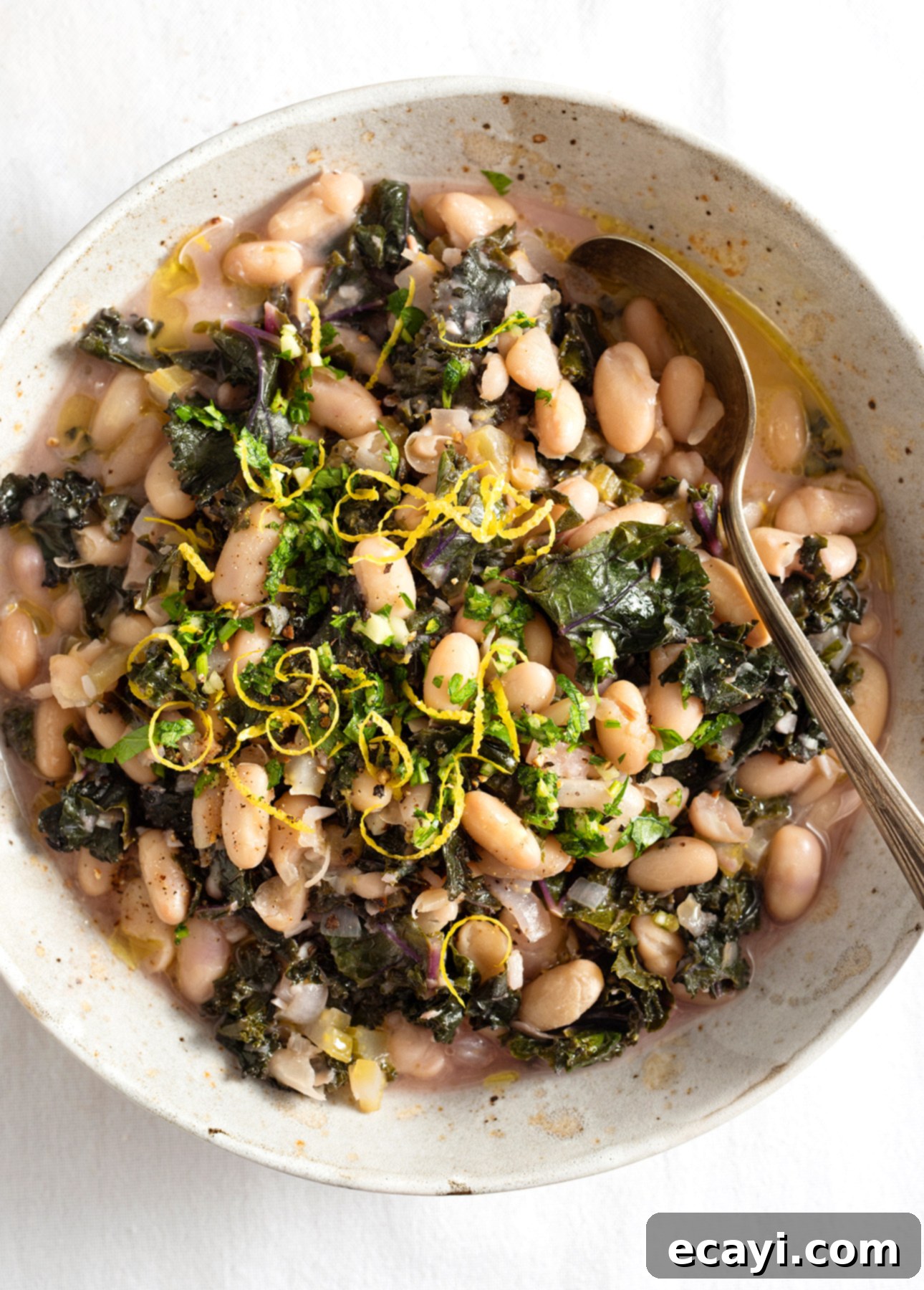 Hearty Cannellini & Kale Stew with Bright Lemon Gremolata 3 Cannellini Bean and Kale Stew with Lemon Gremolata // FoodNouveau.com