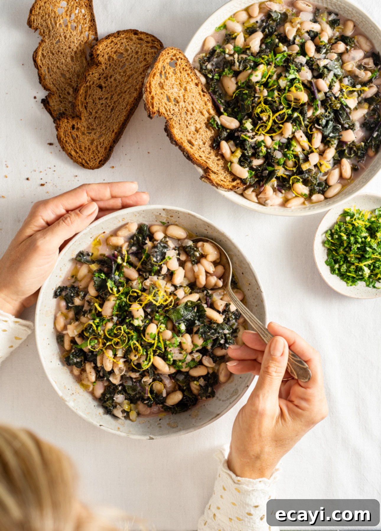Hearty Cannellini & Kale Stew with Bright Lemon Gremolata 4 Cannellini Bean and Kale Stew with Lemon Gremolata // FoodNouveau.com