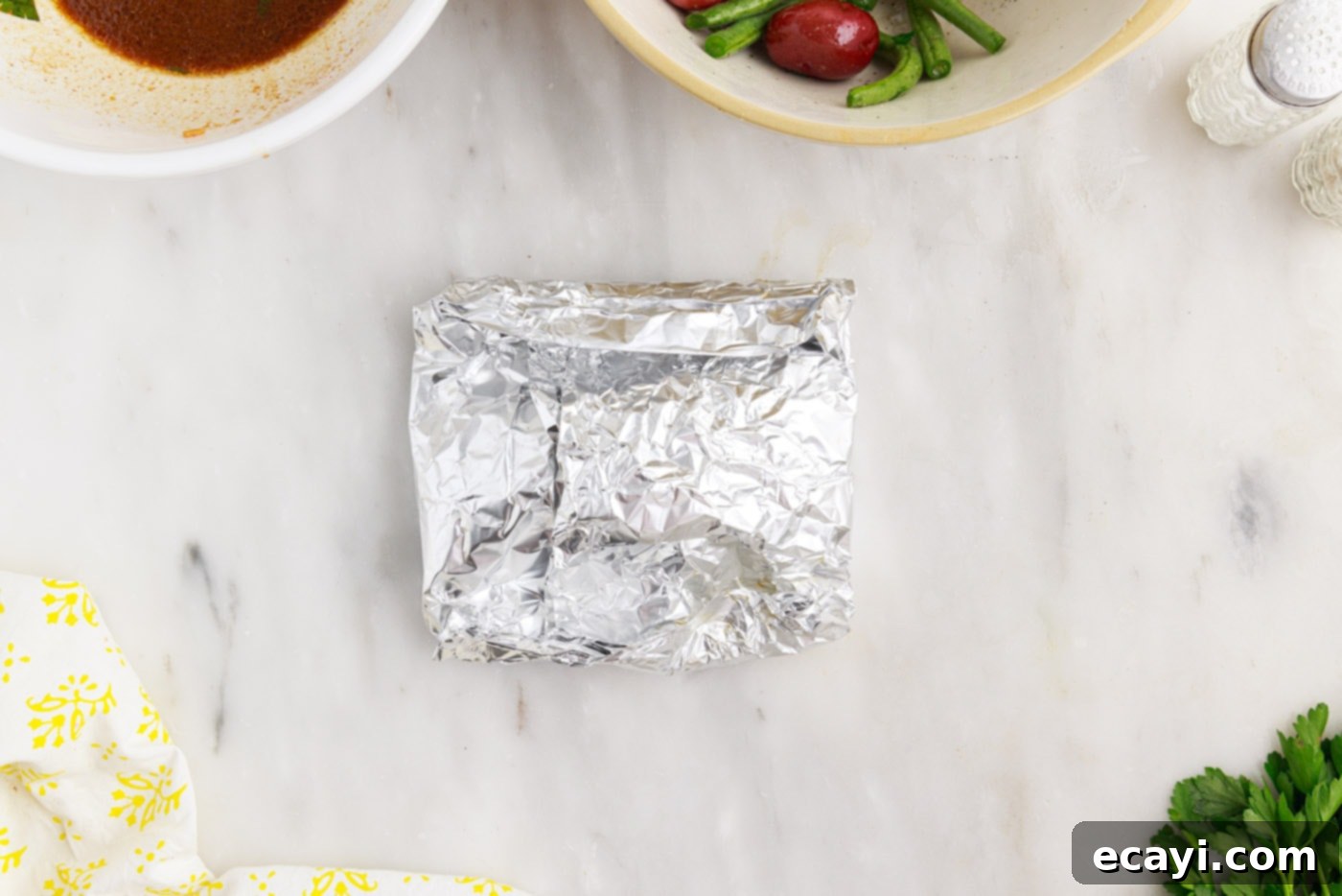 Fireside Foil Feasts 11 folded up chicken campfire foil packets