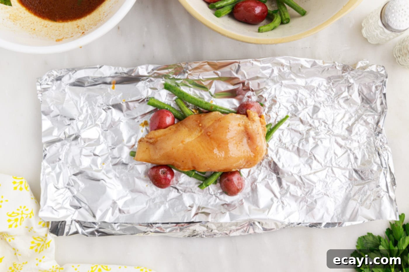 Fireside Foil Feasts 9 chicken over green beans and potatoes in a foil packet