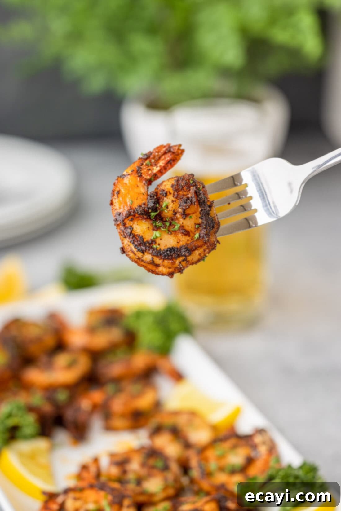 Bayou Blackened Shrimp 7 Close-up of a single Blackened Shrimp on a fork, showing its delicious crust