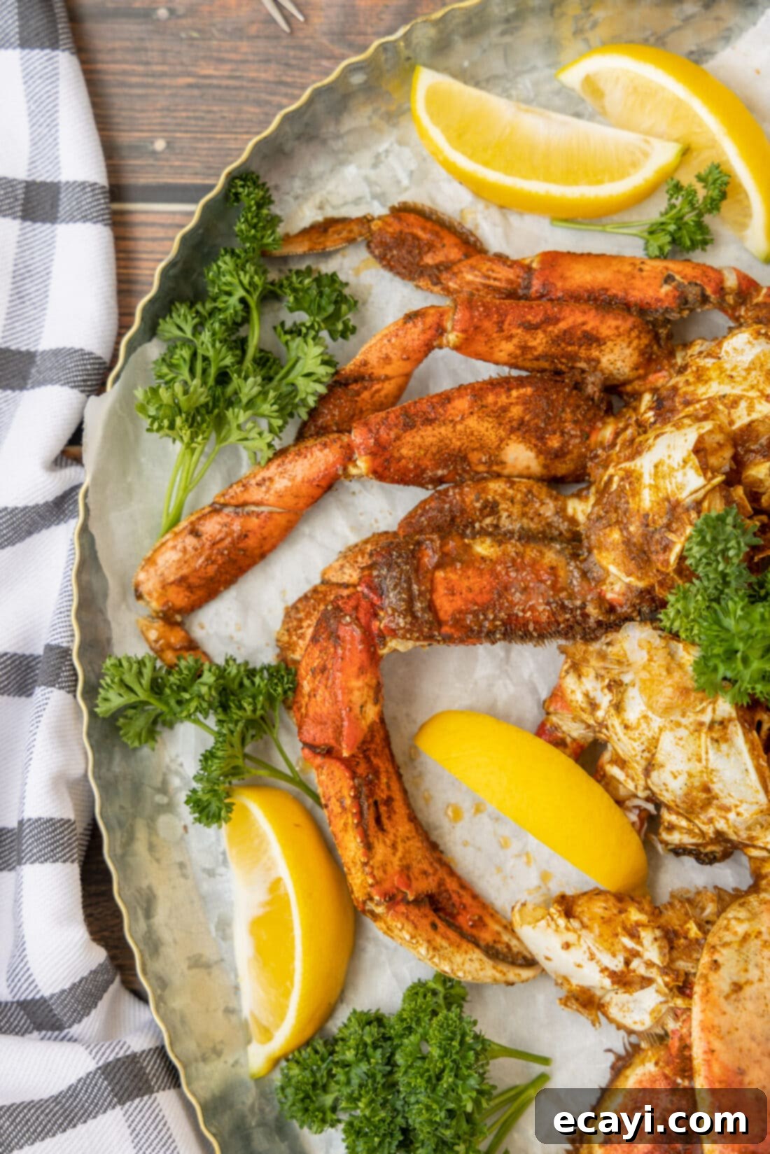 Pacific's Sweetest Catch 2 Platter of Dungeness Crab Legs with lemon wedges, ready to serve.