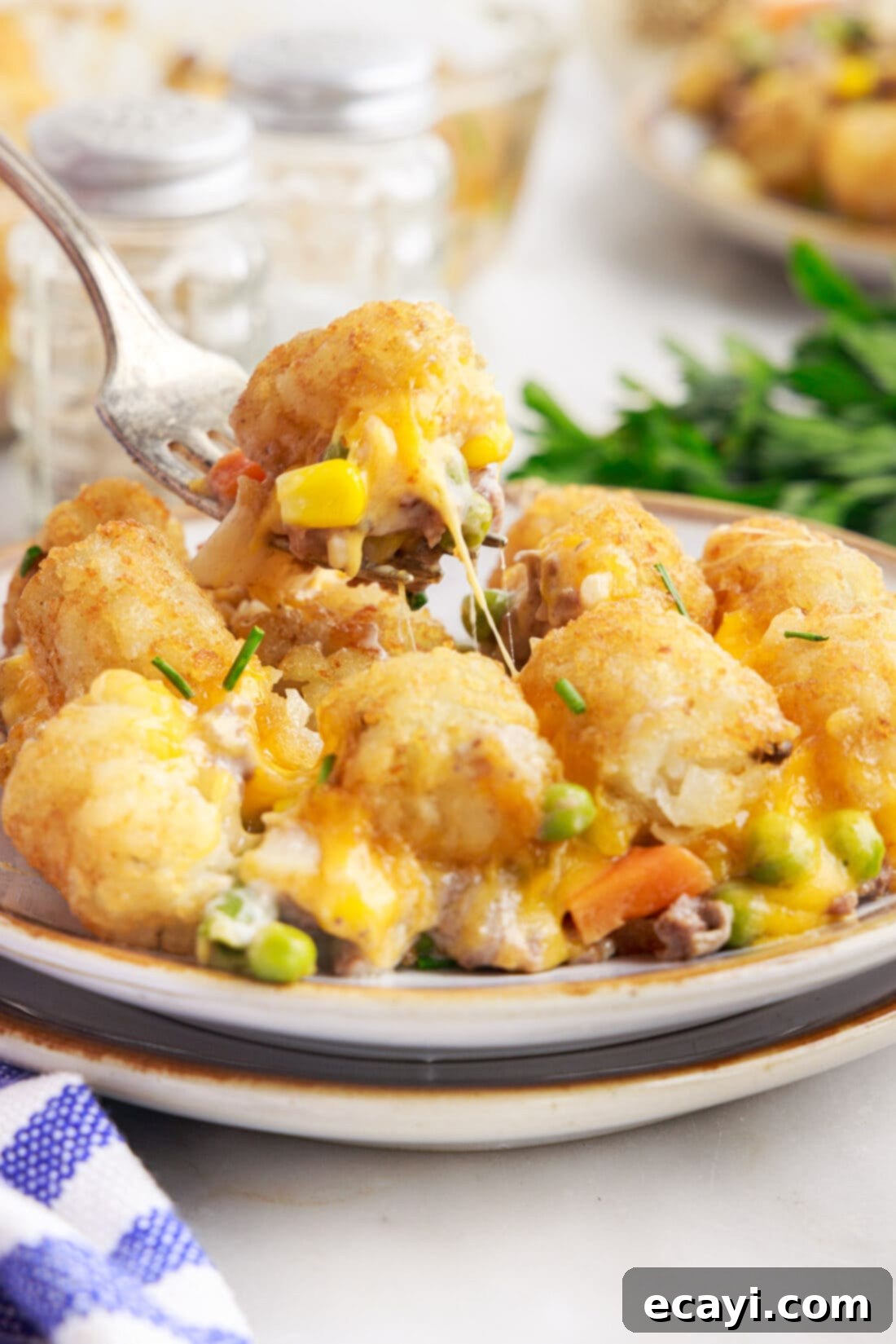Crispy Tatertot Bake 13 A generous portion of Tatertot Casserole served on a white plate