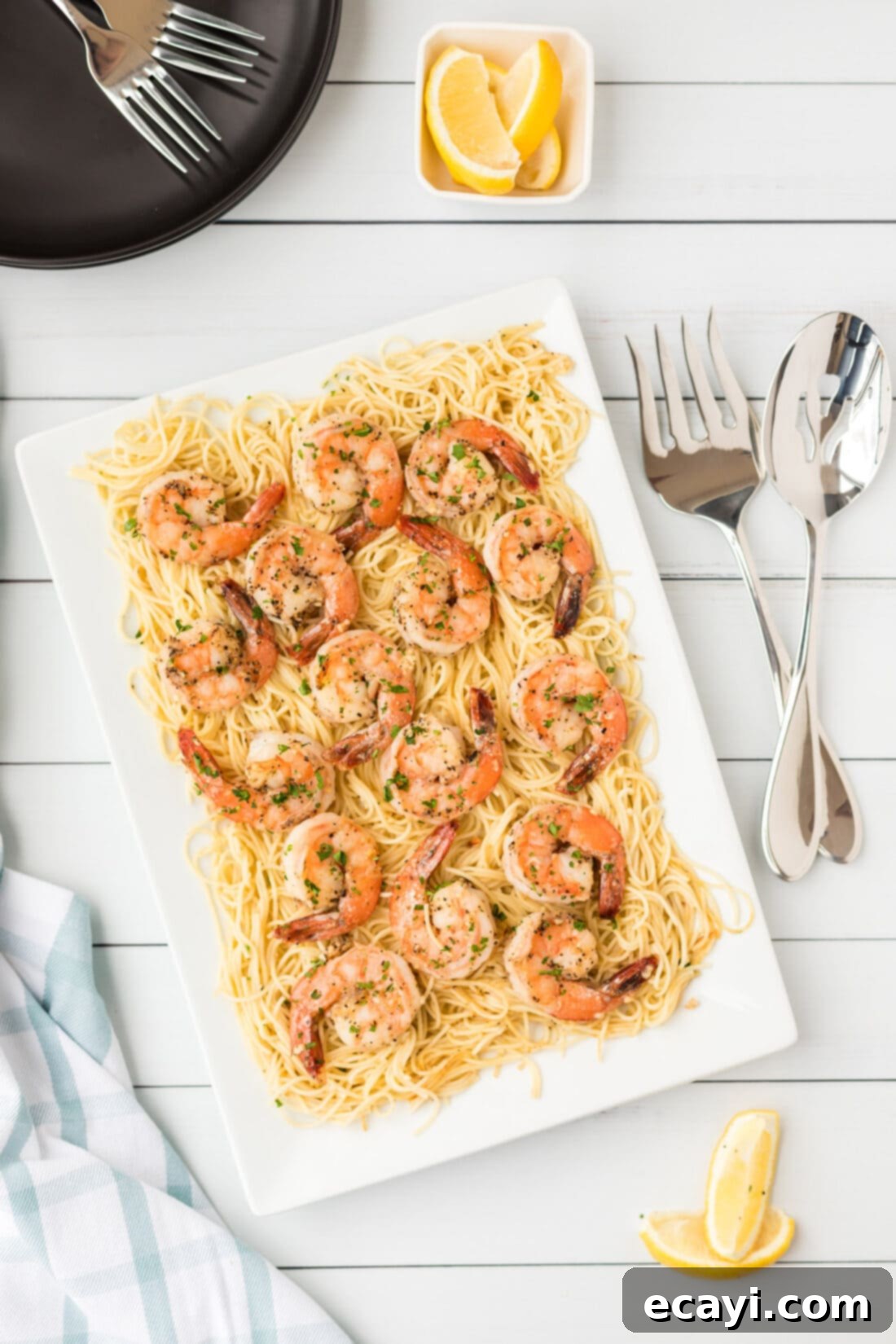 Garlic Butter Shrimp Pasta 3 A beautiful platter of Shrimp Scampi Pasta, garnished with fresh herbs.