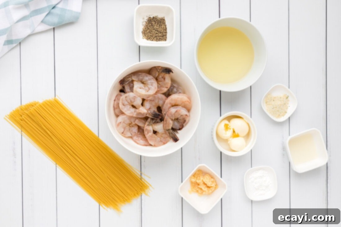 Garlic Butter Shrimp Pasta 4 Ingredients laid out for preparing Shrimp Scampi Pasta.