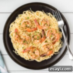 Garlic Butter Shrimp Pasta 8 A perfectly portioned plate of Shrimp Scampi Pasta, garnished and ready to enjoy.