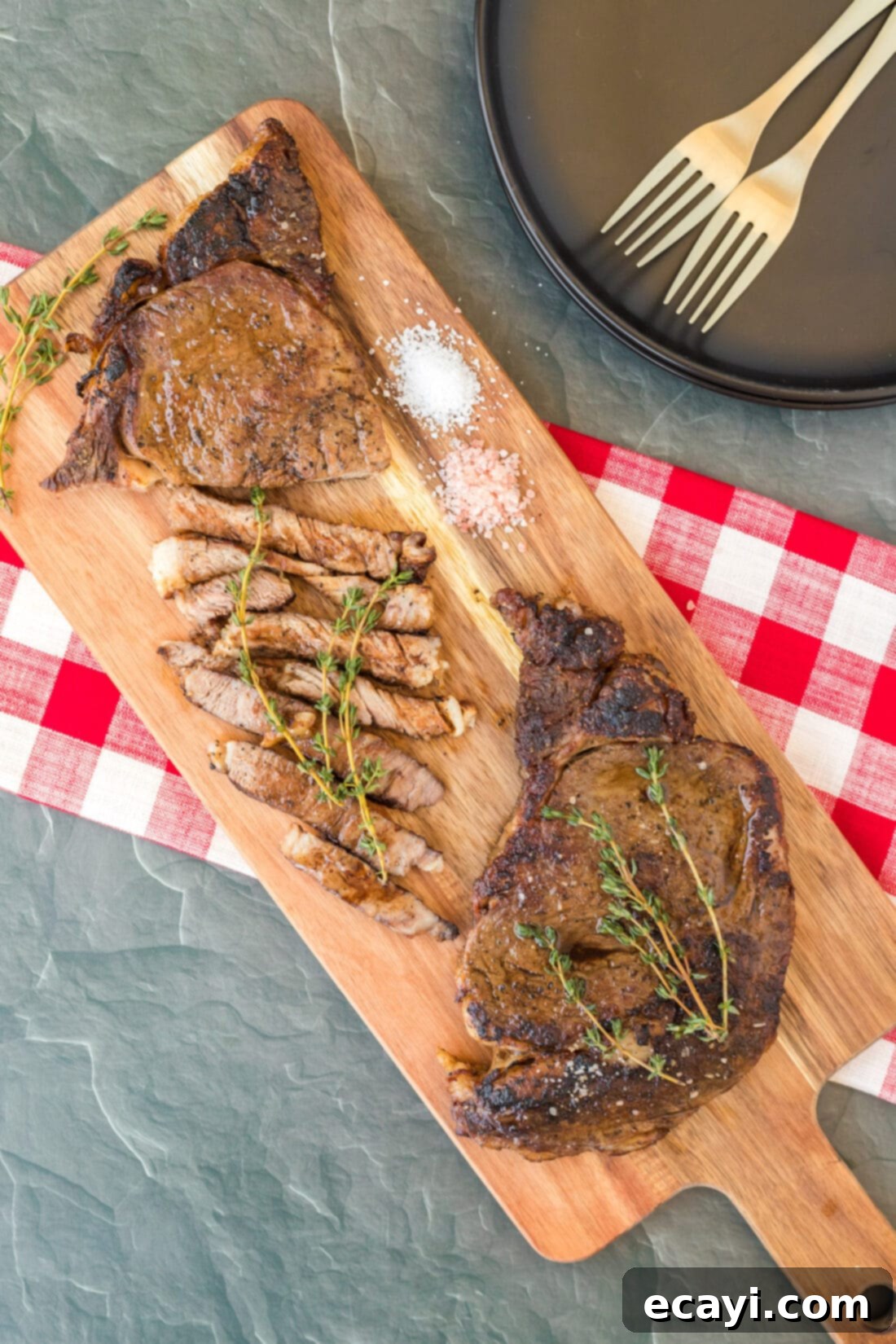 Flawless Reverse Sear Ribeye 8 Reverse Sear Ribeye on board, perfectly sliced to reveal a juicy, pink interior.