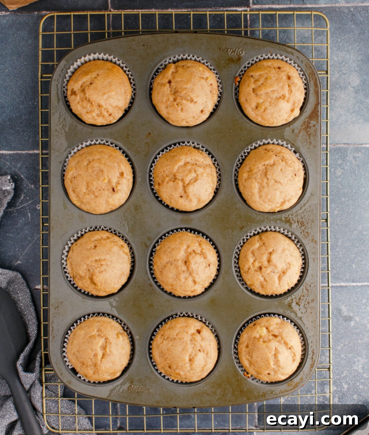 Golden Banana Muffins 11 baked banana muffins cooling on a wire rack