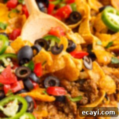 Crunchy Chili Cheese Delight 14 Frito Pie Casserole, a delightful combination of seasoned beef, cheese, and crunchy Fritos.