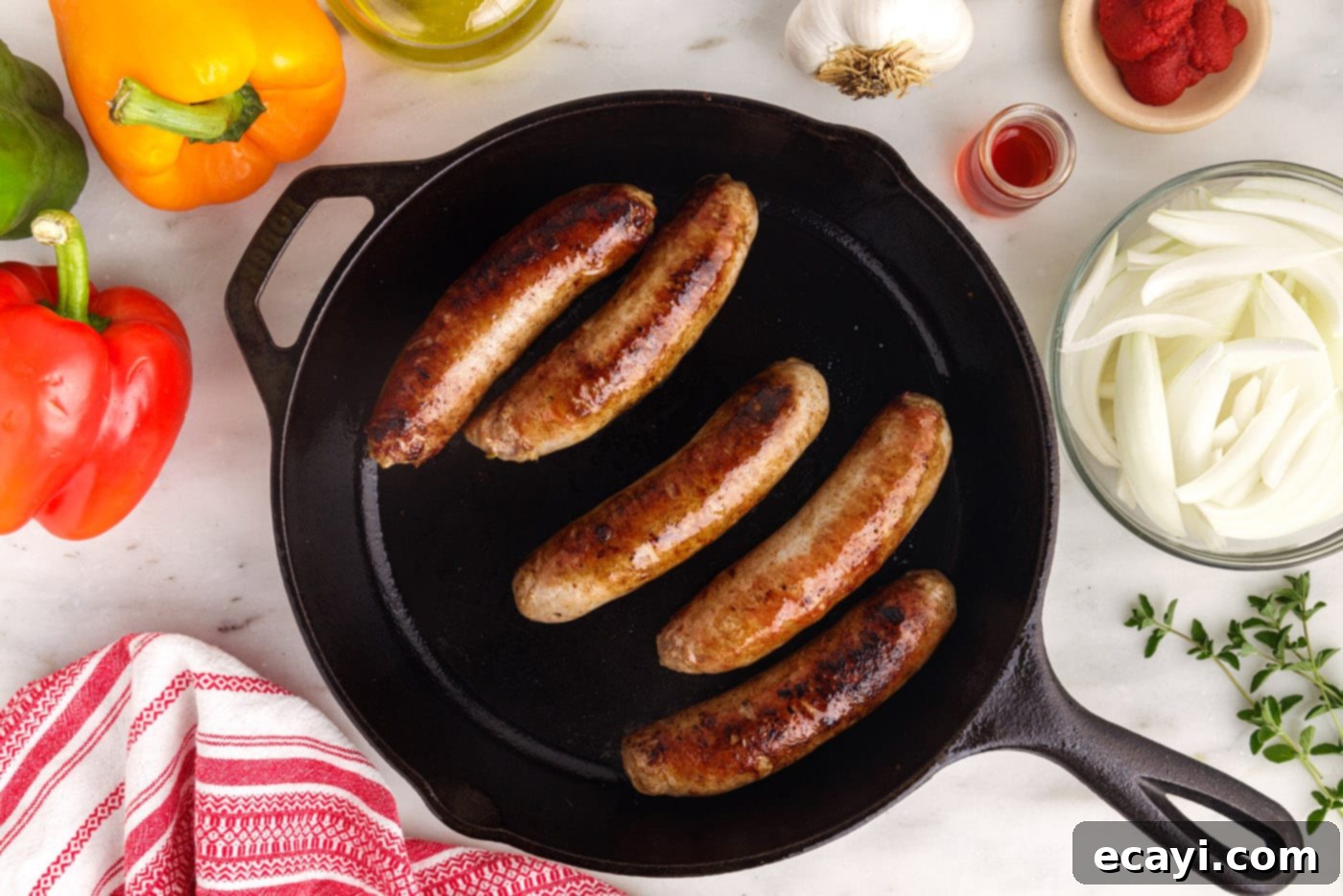 Sausage and Pepper Sizzle 6 Close-up of seared Italian sausage, golden brown and perfectly caramelized, in a skillet.