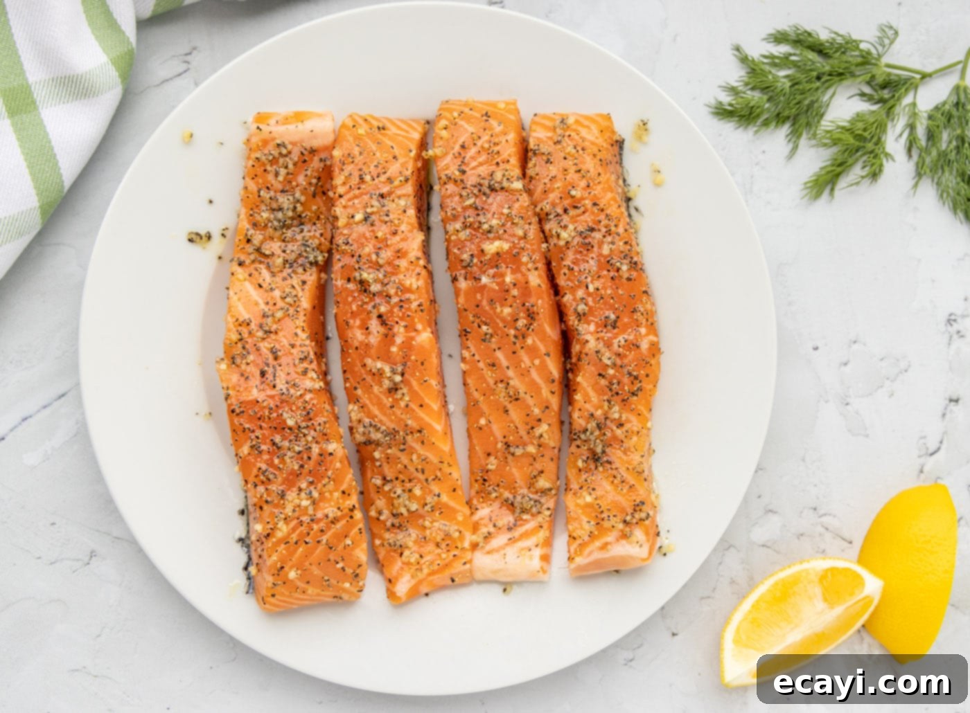 Golden Pan-Seared Salmon 5 Salmon fillets rubbed with salt, pepper, and olive oil, ready for searing
