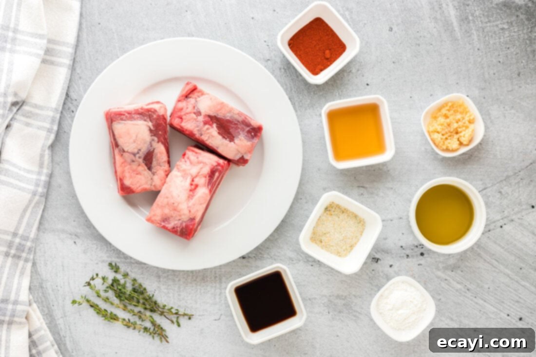 Fall-Off-The-Bone Instant Pot Beef Short Ribs 4 Layout of Instant Pot Beef Short Ribs ingredients including ribs, broth, and seasonings