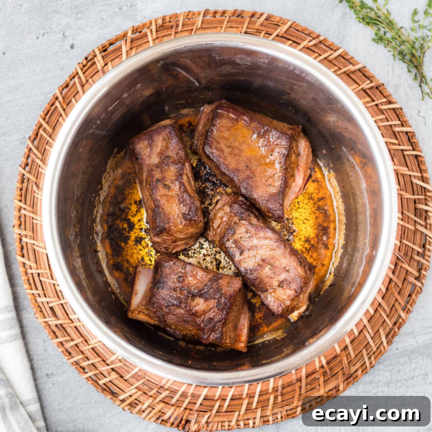 Fall-Off-The-Bone Instant Pot Beef Short Ribs 7 Beef short ribs searing in the Instant Pot