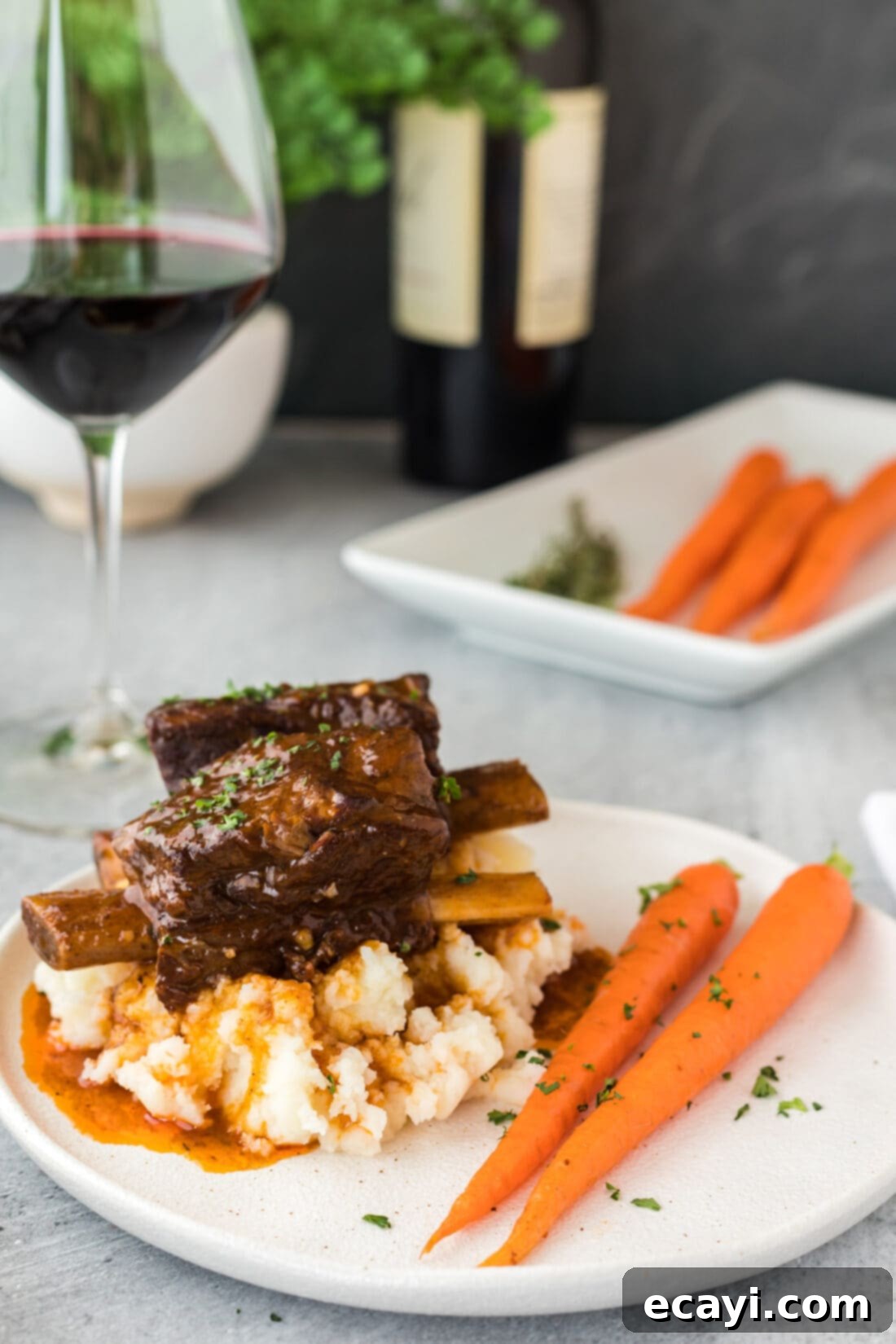 Fall-Off-The-Bone Instant Pot Beef Short Ribs 9 Instant Pot Beef Short Ribs served on a plate with mashed potatoes