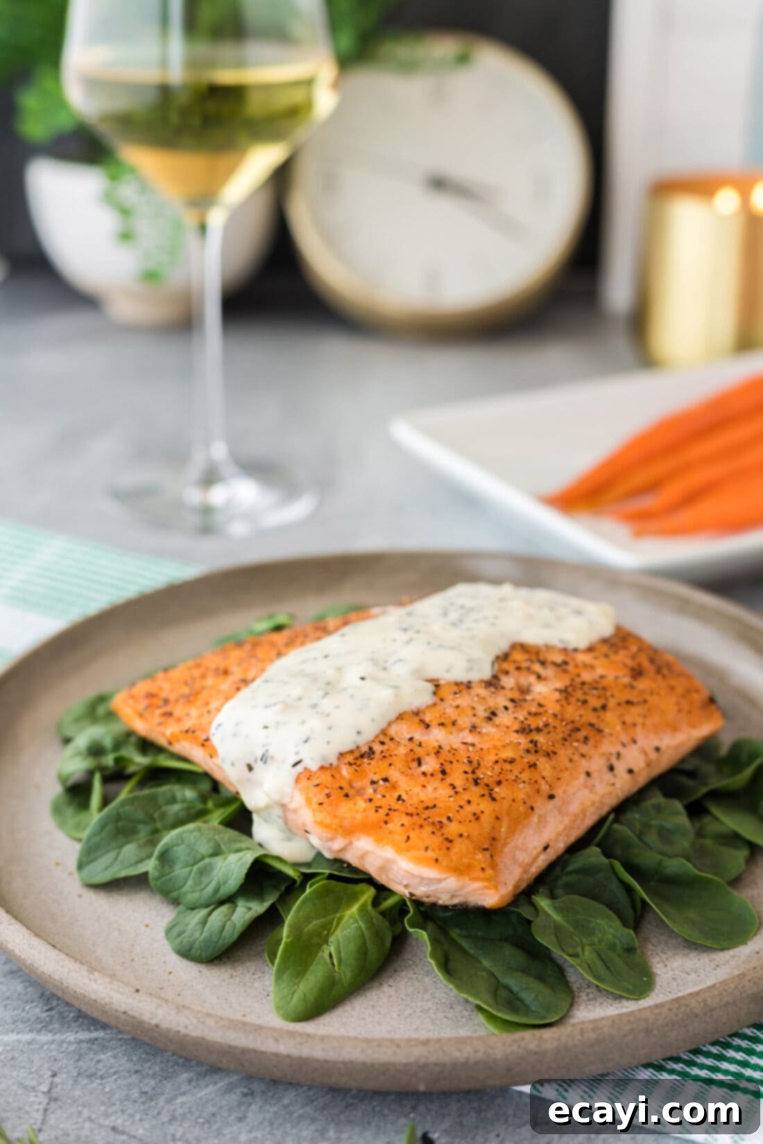Aromatic Rosemary Cream Sauce 3 Pan-seared salmon fillet generously topped with creamy Rosemary Cream Sauce and fresh herb garnish.
